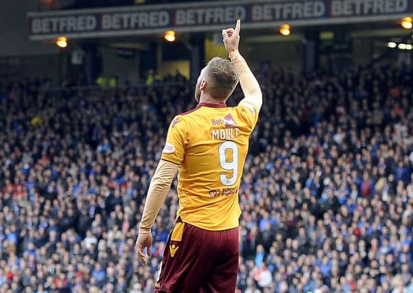 Louis Moult celebrates his second goal in the Scottish League Cup semi-final.