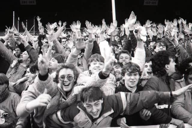 Fans celebrate beating Bury at home on November 15, 1986