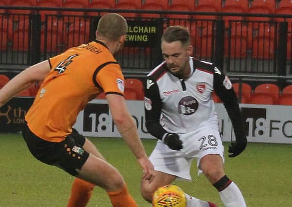 Adam McGurk on the ball for Morecambe at Barnet (photo: Mike Williamson)