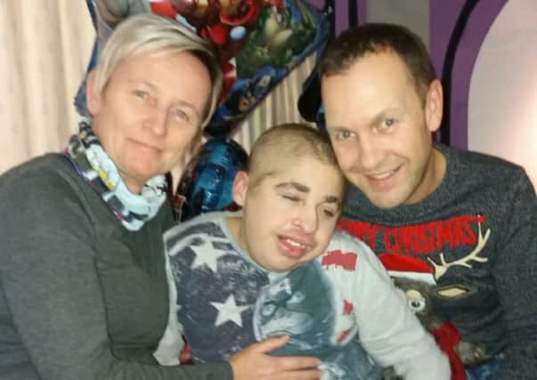 Oliver Ashton, who will be turning 18 this Christmas Day.
Doctors initially told his parents he was unlikely to live past the age of two
Oliver with his mum Yvette Browne and dad Ian Ashton