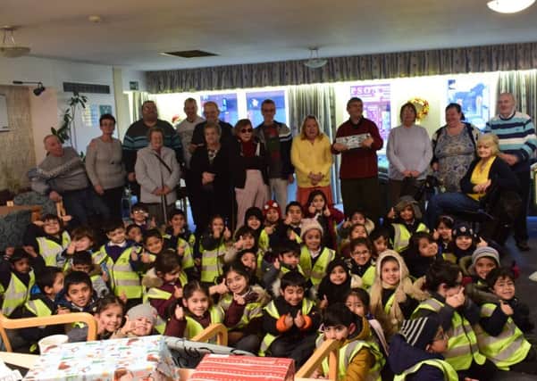 Pupils from Olive Primary School in Preston made festove parcels for elderly residents in their community