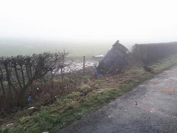 Firefighters staged a rescue after the car ended up on its roof on Lancaster Road, in Preesall