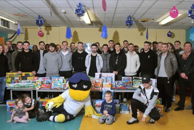 PNE players giving out Christmas presents to the children at Royal Preston Hospital