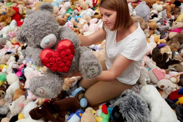 WI member Judith Suckling with some of the 2,000 teddy bears