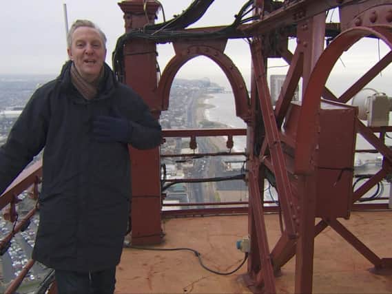 Poet Tony Walsh at the top of Blackpool Tower to recite new work Up 'ere for BBC North West Tonight