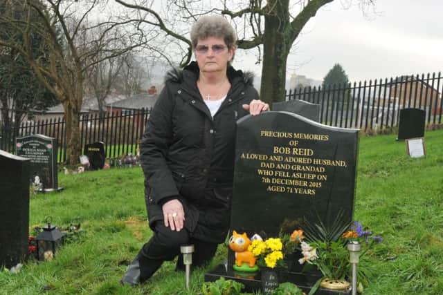 LANCASTER 18-12-17
Widow Marlene Reid, at her late husband Bob's grave - she was upset to find gravediggers had covered it with a box of soil.
