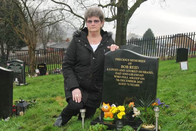 LANCASTER  18-12-17Widow Marlene Reid, at her late husband Bob's grave - she was upset to find gravediggers had covered it with a box of soil.