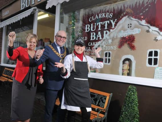 Mayor of South Ribble Coun Mick Titherington and Mayoress Carole with Hannah Booth of Clarkes Butty Bar, Hawksbury Drive, Penwortham, winner of the best dressed window competition