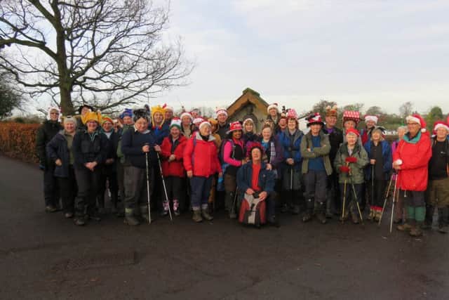 Members of Norwest Fellwalking Club celebrating Christmas on the way to the Corporation Arms, Longridge