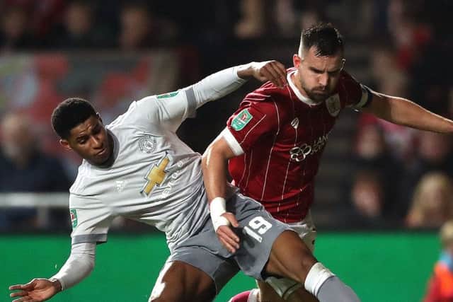 United's Marcus Rashford tries to get the better of Bristol City's ex-PNE defender Bailey Wright
