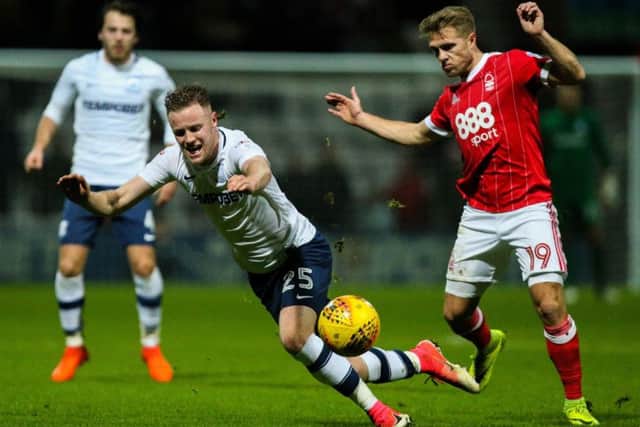 Kevin O'Connor is clipped by Nottingham Forest substitute Jamie Ward