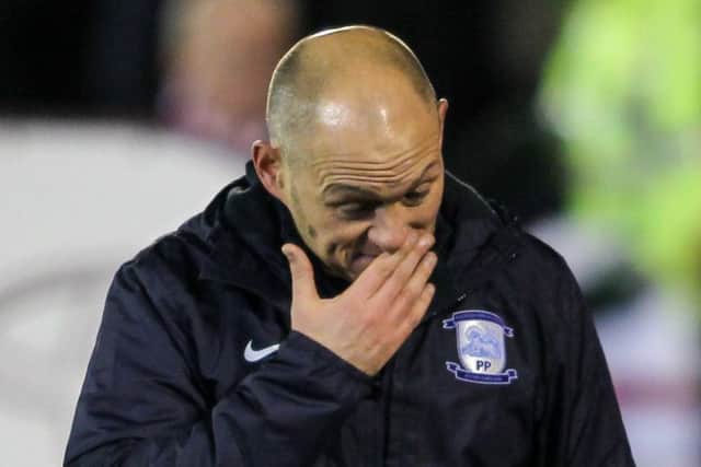 Alex Neil leaves the field disappointed at the final whistle.