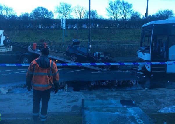 The car being recovered following the collision in Caton Road on Wednesday December 27. Photo by Mike Brown.
