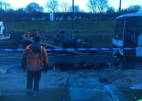 The car being recovered following the collision in Caton Road on Wednesday December 27. Photo by Mike Brown.