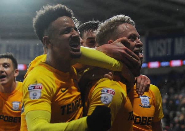 Tom Clarke celebrates scoring the winner against Cardiff