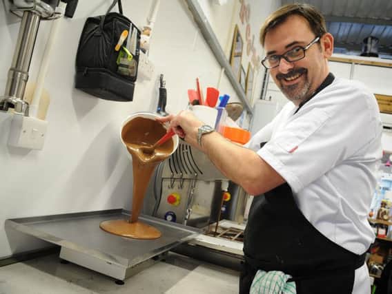 Lancashires own Willy Wonka, Paul Williams pours chocolate onto a cooling tray.