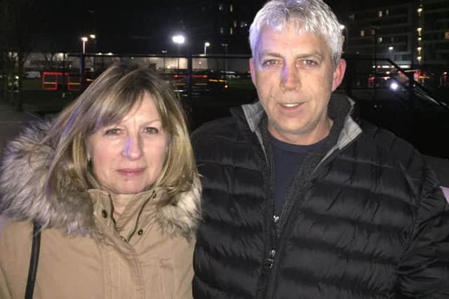 Car owner Kerry Matthews and partner Patricia Heath as hundreds of cars have been destroyed after fire tore through a 1,600-capacity multi-storey car park next to the Echo Arena in Liverpool.