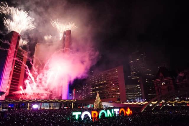 Fireworks go off to mark the beginning 2018 during New Years Eve celebrations held at Nathan Phillips Square in Toronto