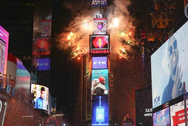The ball drops during the New Year's Eve celebration in Times Square on Sunday, Dec. 31, 2017, in New York