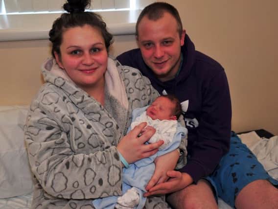 New Year's Day baby Aaron-Lee Marcus Hough with parents Jodie Miller, 22, and David Hough, 25.