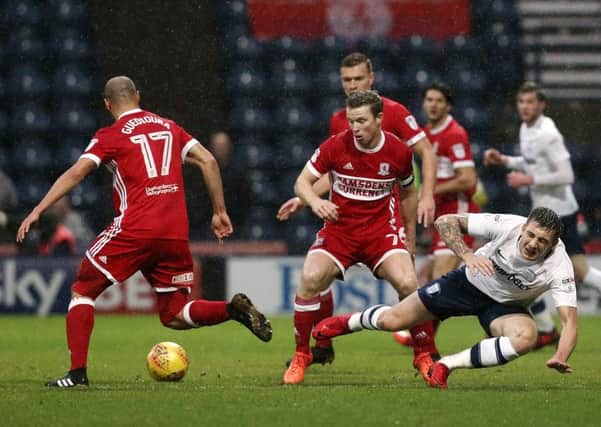 Jordan Hugill is tackled by Middlesbrough's Grant Leadbitter