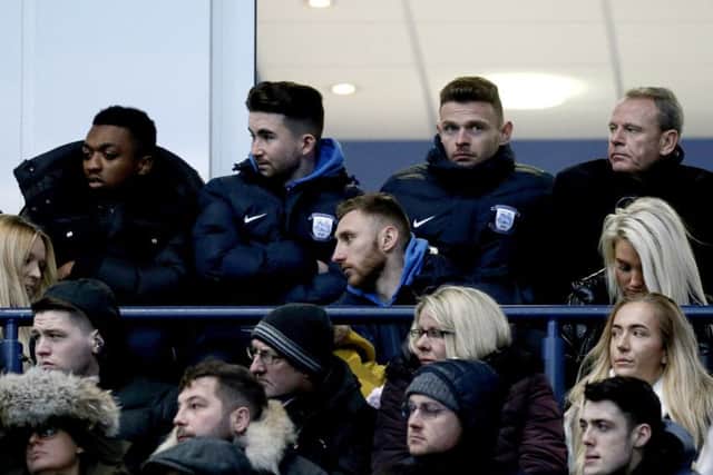 New Preston North End signing Louis Moult (centre) watches the game against Middlesbrough.