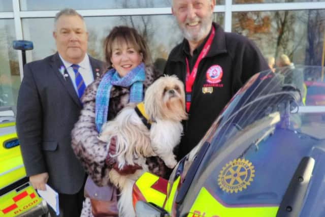Coun Joan Burrows with pet therapy dog Lola at a Blood Bikes Rotary event