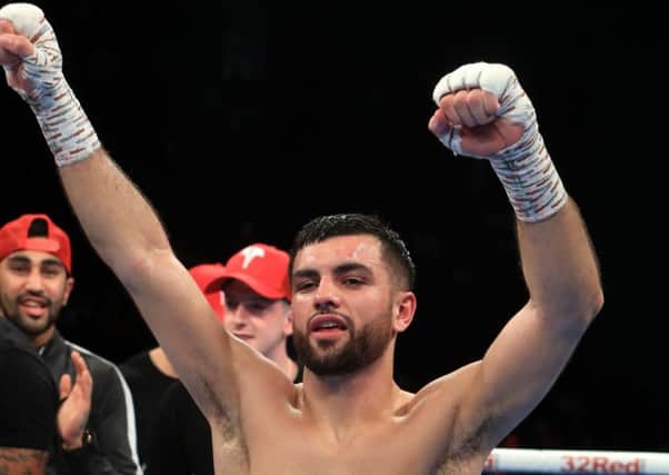 Jack Catterall  celebrates beating Tyrone Nurse after their Super Lightweight bout at the First Direct Arena, Leeds.