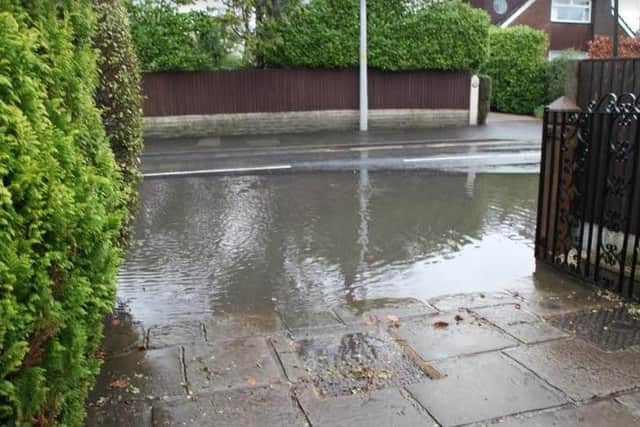 The flooded road and driveway at Black Bull Lane