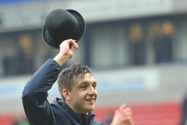 PNE striker Jordan Hugill tips his hat to the fans at the 2016 Gentry Day at Bolton