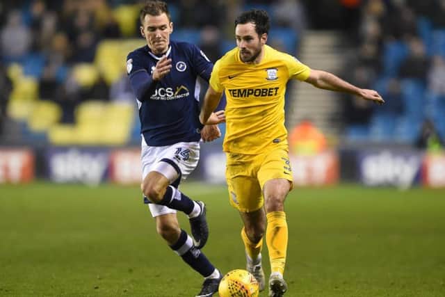 Greg Cunningham takes on Millwall's Jed Wallace