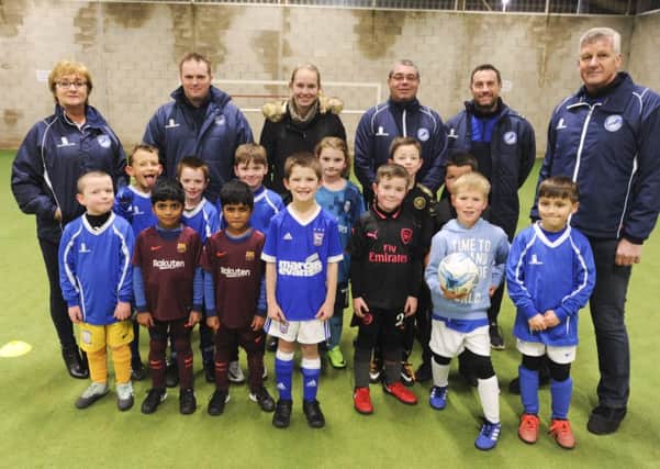 Peter Mason and Kath Mason from the Sir Tom Finney Soccer Centre.  They are pictured (far left and far right) with U7s and U8s and their coaches.