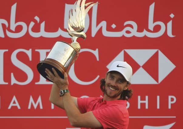 Tommy Fleetwood holds the trophy
