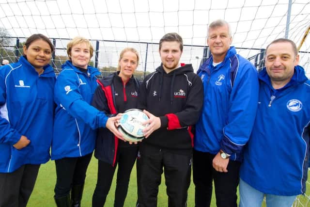 UCLans Cian McEvoy and Sarah Berry (centre) with the Sir Tom Finney Preston Soccer Centre team.