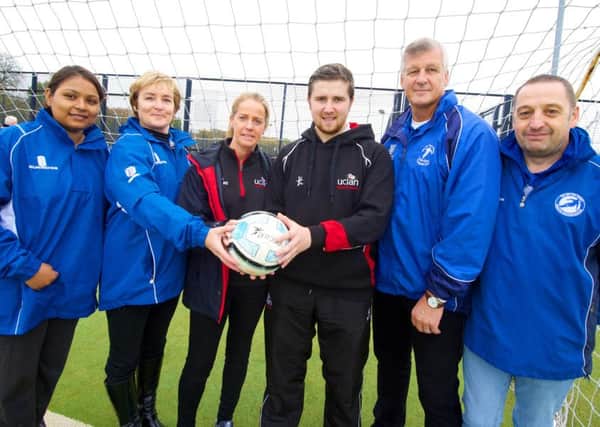 UCLans Cian McEvoy and Sarah Berry (centre) with the Sir Tom Finney Preston Soccer Centre team.