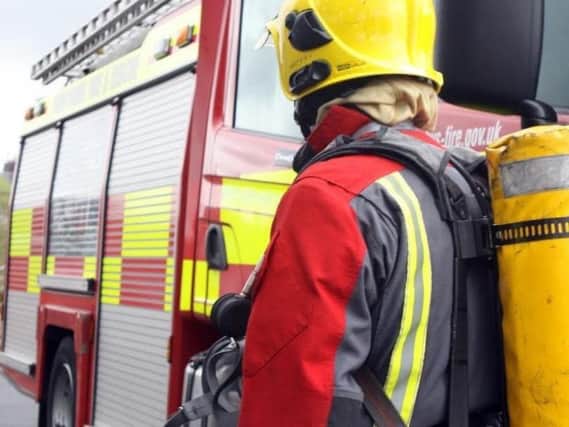 A man was rescued after he became trapped in his car following a crash in Longridge, say fire services.