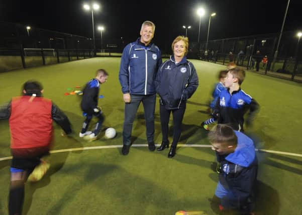 Peter and Kath Mason watch youngsters train at UCLan Preston Sports Arena