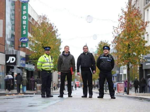 George Holroyd of Preston City Council, Vinnie Thomson of Discover Drug  Alcohol Recovery Services, PCSOs Conor Tomlinson and Ashley Lawton prepare for a further crackdown on street begging in Preston