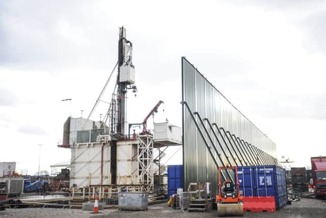 The drilling rig and huge green wall designed to reduce sound pollution in the neighbouring area at Cuadrilla's Preston New Road fracking site
