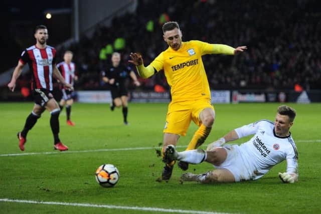 FA CUP ACTION: PNE's Louis Moult is tackled by Sheffield United's Simon Moore. PIC: www.camerasport.com