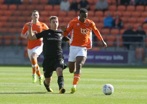 Ryan Ledson, left, in action against Blackpool.