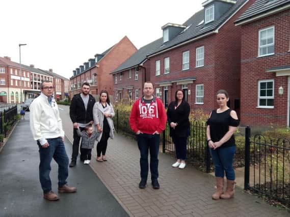 Craig Dixon, in the red, with other residents in Elan Place in Buckshaw Village. 
On the far left: Conservative county councillor for Euxton, Buckshaw and Astley, Aidy Riggott