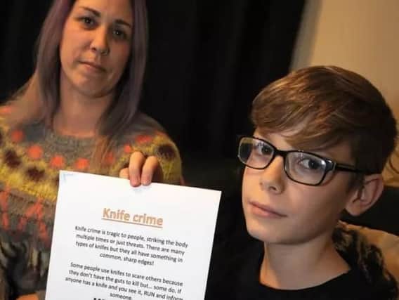 10-year-old Ethan Leigh was threatened with a knife by another pupil at school. Ethan and mum Sacheen with a knife crime poster that he designed
