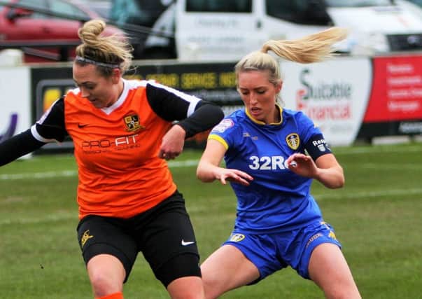 Scarlett Smith battles with a Leeds United defender