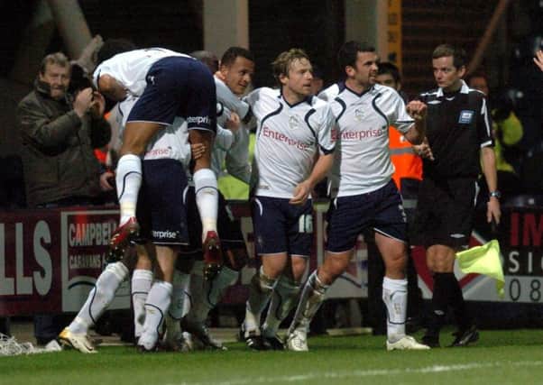 Simon Whaley (centre) is congratulated by his team-mates after scoring for Preston in a 3-0 win over Hull City in December 2007