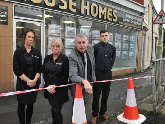 Mark Rushe of Stonehouse Homes Estate & Letting Agents, with Marie Lamb, Karen Rushe and James Ashurst, concerned that traffic barriers have not been replaced outside the business