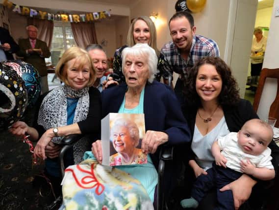 Bette Reid celebrates her 100th birthday at the Highcliffe Residential Home, Whittle Le Woods. A host of family and friends also attended the party to mark her big day. Bette with her family l-r daughter and son-in-law Liz and Nigel Brookes, grand daughter Anna Schofield with husband Nigel and grand daughter Amy Griffiths with great grandson Samuel Griffiths aged 18 weeks. Picture by Paul Heyes