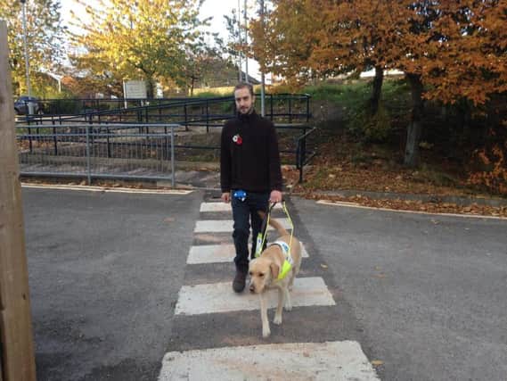 Robert Greggor with his guide dog Angel