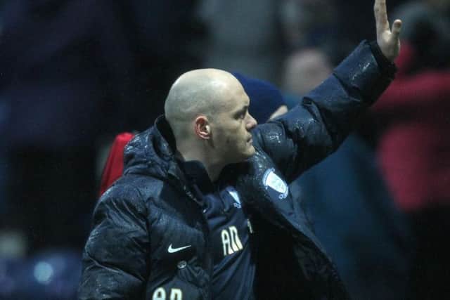 Alex Neil salutes the PNE fans after the win over Hull