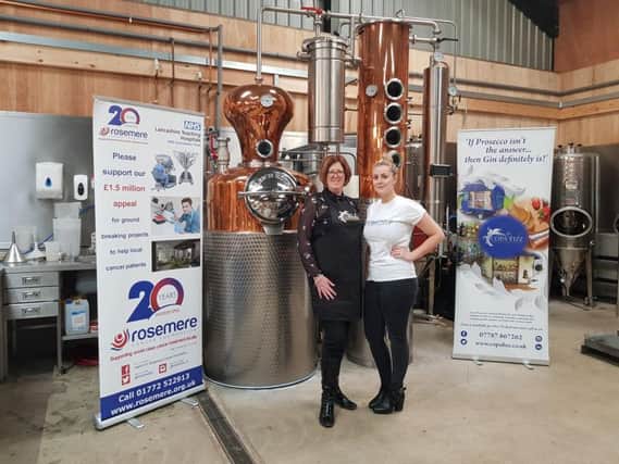 Copa Fizzs Gillian Bartlett (left) and Rosemere Cancer Foundations central area fundraising co-ordinator Rebecca Hall by a vat of the Copa Fizz Rosemere Gin